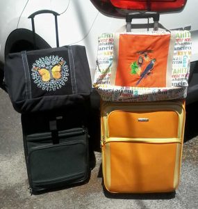 Tote bags on luggage