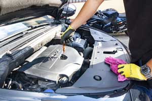 Car mechanic with a rag