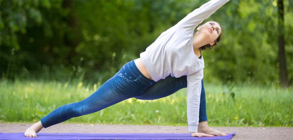 Stretch jeans on woman doing yoga