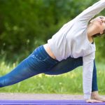 Stretch jeans on woman doing yoga